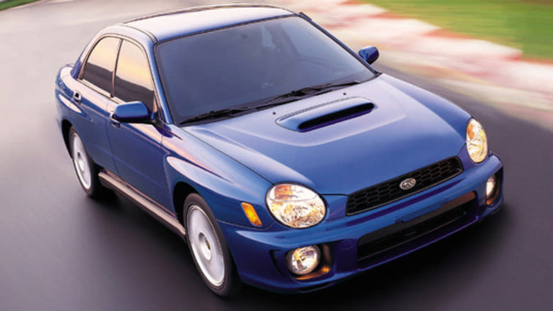 2002 Subaru Impreza WRX driving on a racetrack