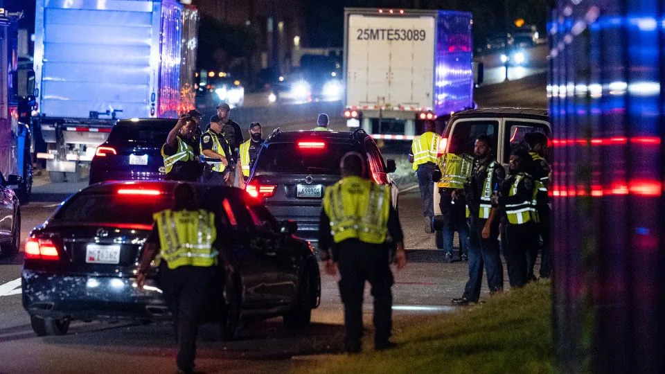 Metropolitan Police Department officers and federal agents operate a vehicle checkpoint on New York Avenue NE in Washington, DC, on Wednesday. - Eric Lee for CNN