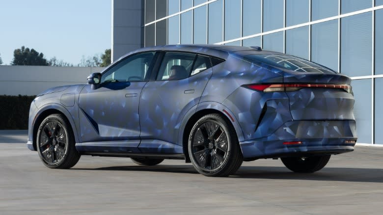 Rear 3/4 view of a camouflaged Acura RSX prototype