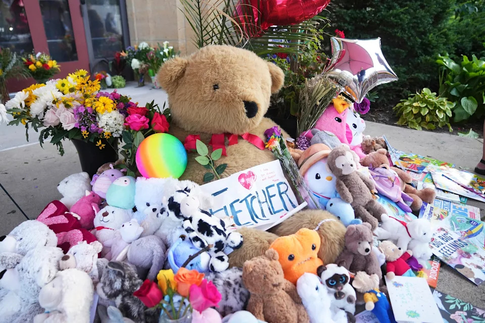 Abbie Parr/AP - PHOTO: Items including dolls are placed at a memorial at Annunciation Catholic Church after Wednesday's school shooting, Aug. 28, 2025, in Minneapolis.
