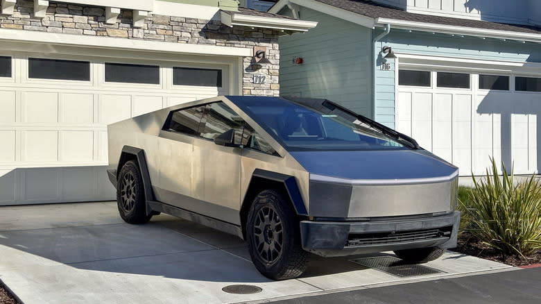 tesla cybertruck parked in driveway