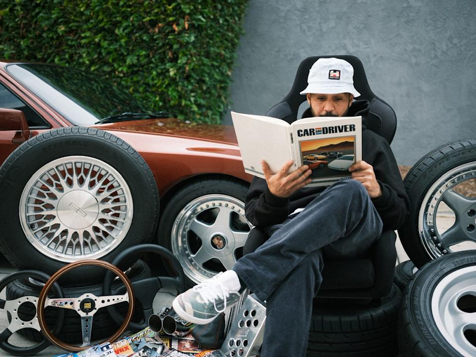 man reading car and driver