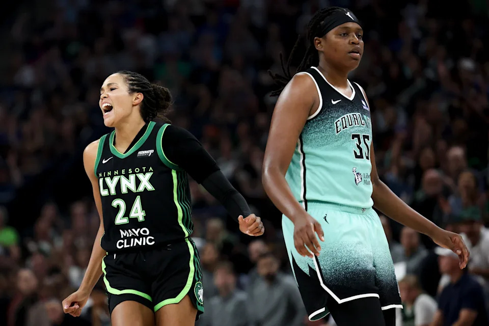 MINNEAPOLIS, MINNESOTA - JULY 30: Napheesa Collier #24 of the Minnesota Lynx celebrates after scoring a three-point shot while Jonquel Jones #35 of the New York Liberty reacts during the second quarter at Target Center on July 30, 2025 in Minneapolis, Minnesota. NOTE TO USER: User expressly acknowledges and agrees that, by downloading and or using this photograph, User is consenting to the terms and conditions of the Getty Images License Agreement. (Photo by Ellen Schmidt/Getty Images)