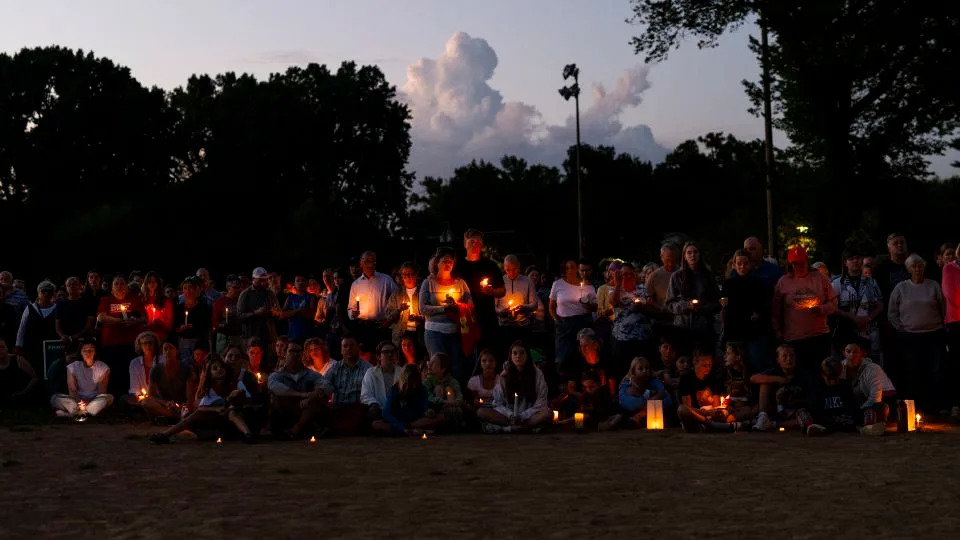 People attend a vigil following a mass shooting at Annunciation Catholic School on Wednesday in Minneapolis. - Stephen Maturen/Getty Images