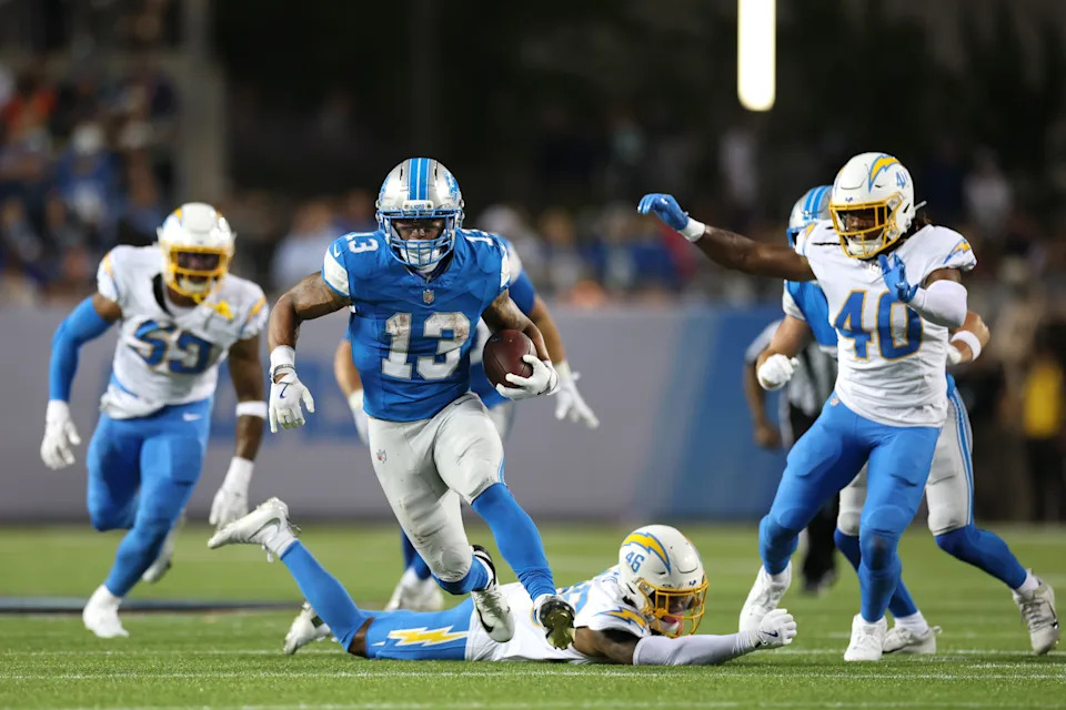 Jul 31, 2025; Canton, Ohio, USA; Detroit Lions running back Craig Reynolds (13) runs against the Los Angeles Chargers in the second quarter at Tom Benson Hall of Fame Stadium. Mandatory Credit: Scott Galvin-Imagn Images