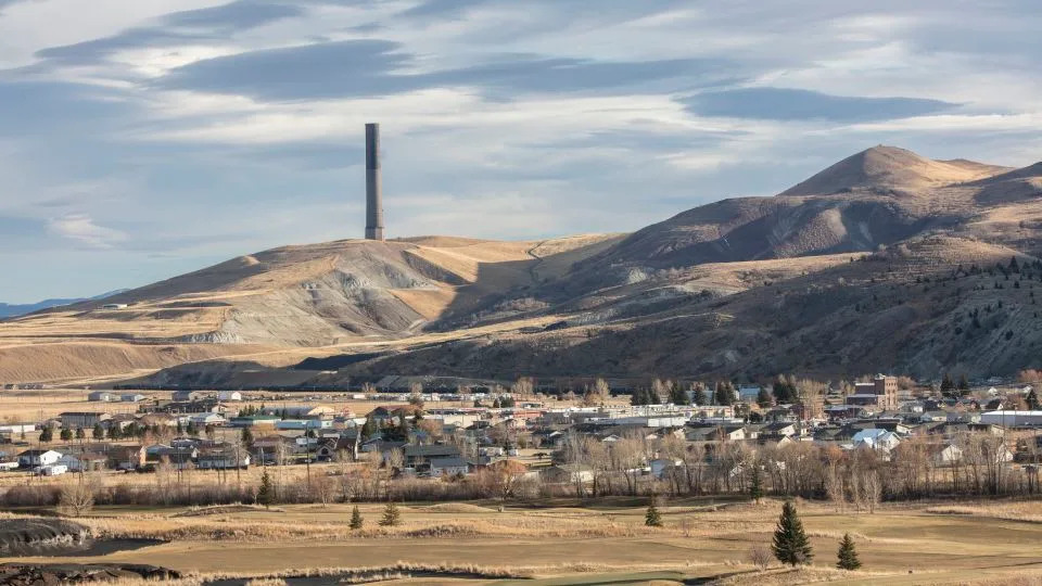 The Anaconda Smelter, which was in operation for 97 years before closing in 1980, looms in the background of this view of the town in 2019. - Louise Johns for The Washington Post/Getty Images