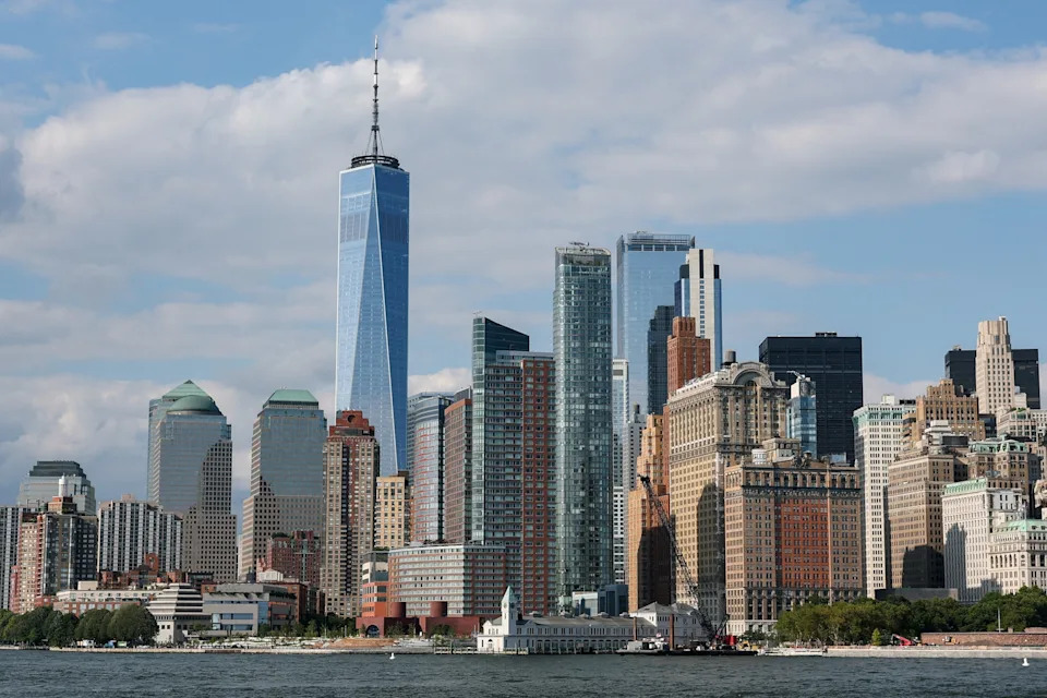 Kylie Cooper/Reuters - PHOTO: One World Trade Center rises amongst the downtown Manhattan skyline in New York