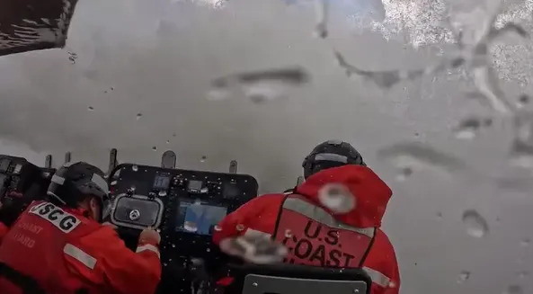 A massive wave produced by Hurricane Erin hits a U.S. Coast Guard boat off North Carolina on Friday, Aug. 22.