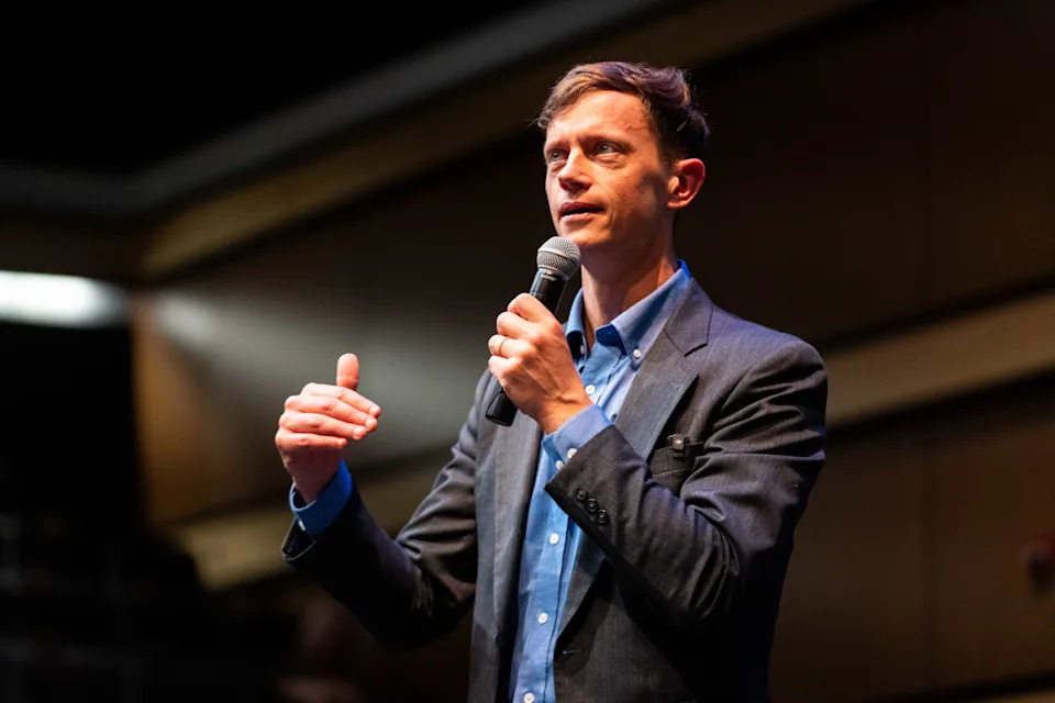 Rob Sand speaks to attendees of his Waukee town hall event on June 25, 2025, at the Waukee Theatre Arts Center.