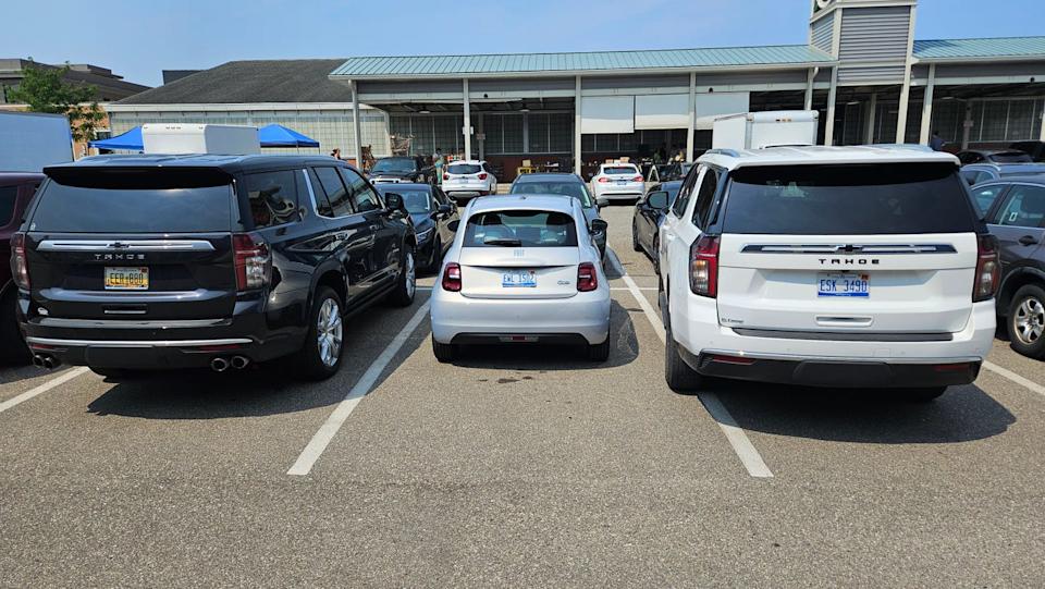 fiat 500e outmatched in royal oak parking lot