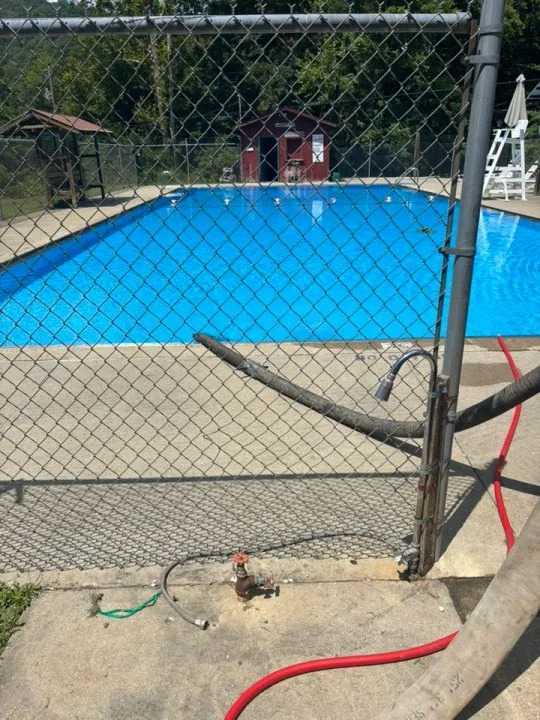 Due to the rural area of the fire, crews used a nearby swimming pool to supply their equipment. (Millers Creek Fire Department)
