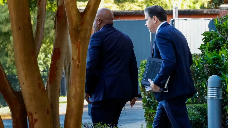 Deputy Attorney General Todd Blanche, right, leaves his hotel for the federal courthouse on Friday in Tallahassee, Florida. - Colin Hackley/AP