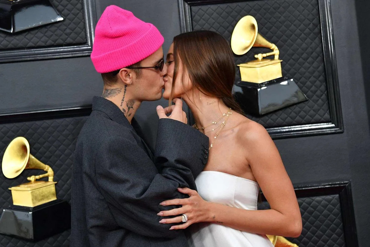 ANGELA WEISS/AFP/Getty Justin and Hailey Bieber at the 2022 Grammys