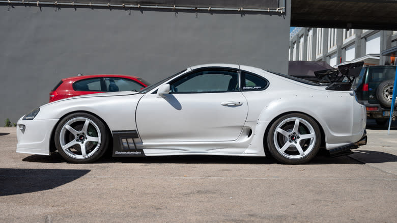 left side view of white Mk IV Toyota Supra parked outdoors