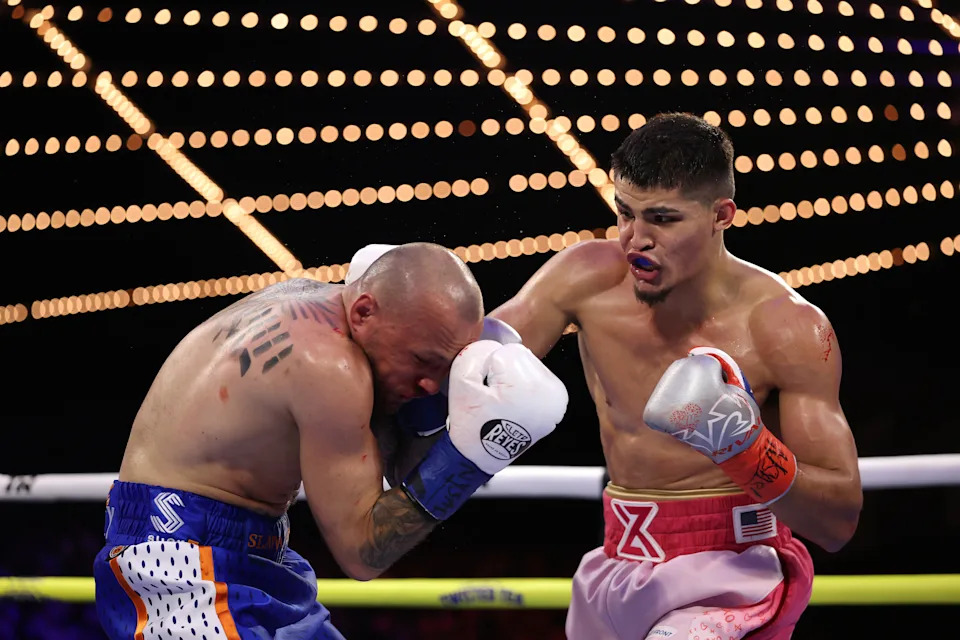 NEW YORK, NEW YORK - FEBRUARY 14: Xander Zayas punches Slawa Spomer during their junior middleweight fight during their junior bantamweight fight during their lightweight fight during their welterweight fight, during their heavyweight fight at The Theater at Madison Square Garden on February 14, 2025 in New York City. (Photo by Al Bello/Getty Images)