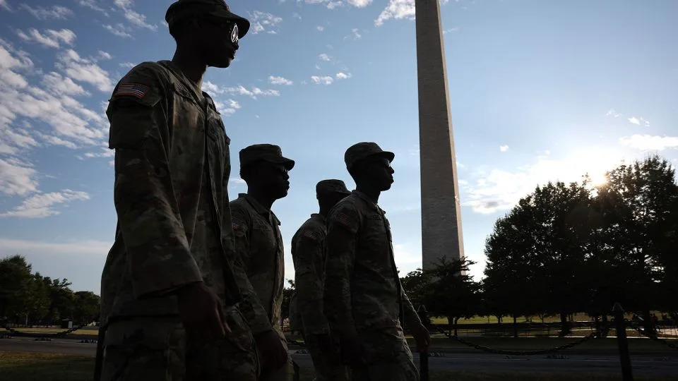 Members of the National Guard patrol near the Washington Monument on August 12 in Washington, DC. - Win McNamee/Getty Images