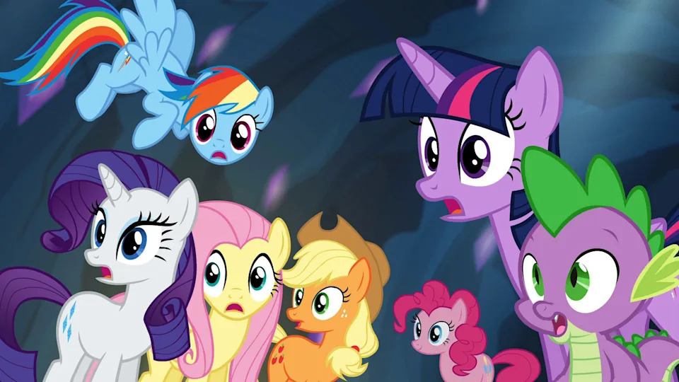 Characters from "My Little Pony" look surprised in a magical setting