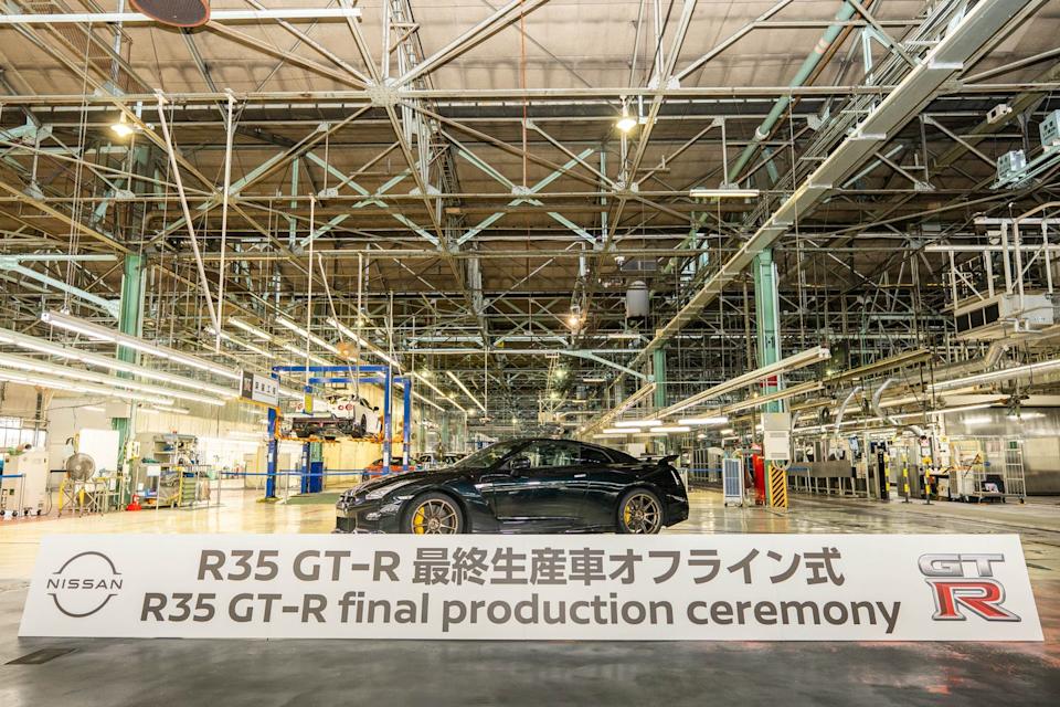 the final r35 gtr rolls down the assembly line in nissan plant side profile