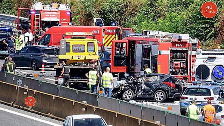 screenshot from a video showing the accident site on the Italian A4 with a mangled Peugeot 207 and lots of emergency vehicles