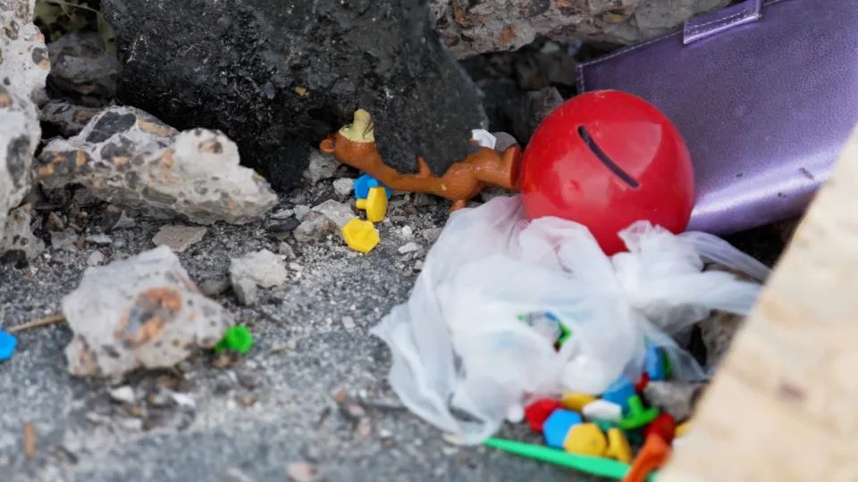Toys were left flipped onto the roof of the apartment building following the strike.  - CNN
