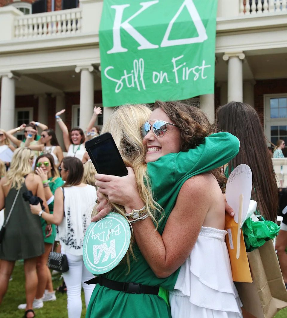 New Kappa Delta sisters hug in front of the Kappa Delta house during the University of Alabama's Formal Sorority Recruitment Bid Day on Sorority Row in Tuscaloosa, Ala. on Saturday, Aug. 13, 2016. More than 2,600 students participated in recruitment, with the largest recruitment class in the nation, and 2,488 received bids from the 16 participating Panhellenic sororities.  Staff Photo/Erin Nelson