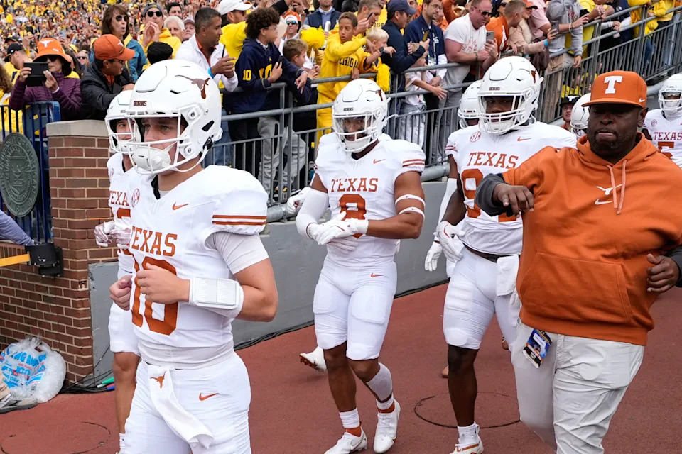 FILE - Texas quarterback Arch Manning (16) takes the field before an NCAA college football game against Michigan in Ann Arbor, Mich., Saturday, Sept. 7, 2024. (AP Photo/Paul Sancya, File)