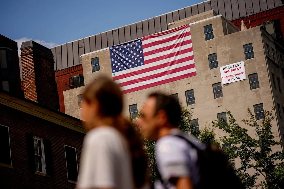 Image: Giant Sign And American Flag On Building Near White House Praises Trump (Andrew Harnik / Getty Images)