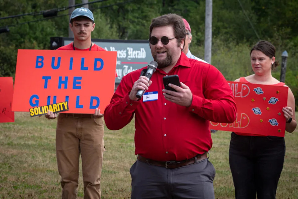  Times Record reporter Paul Bagnall speaks at a union rally outside the Portland Press Herald in South Portland on Tuesday, Aug. 19, 2025. An experienced reporter, Bagnall makes $10 less an hour than a starting reporter at the Press Herald. (Photo by Troy R. Bennett/ Maine Morning Star)