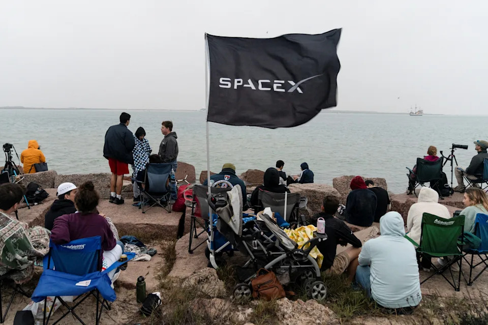 Spectators gather on South Padre Island March 14, 2024 to watch the planned launch of SpaceX's next-generation Starship spacecraft from the company's Boca Chica launchpad, near Brownsville, Texas.