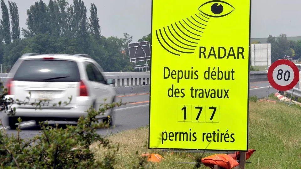 A vehicle passes a sign of the Vaud Cantonal Police indicating the number of driving licenses withdrawn for speeding in the construction zone on the A1 motorway between Lausanne and Yverdon, Switzerland, Tuesday, June 15, 2010. - DOMINIC FAVRE/AP