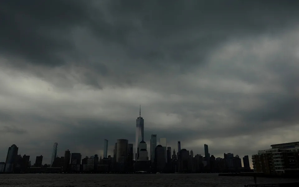 Gary Hershorn/ABC News - PHOTO: A thunderstorm passes over lower Manhattan in New York City, July 31, 2025.