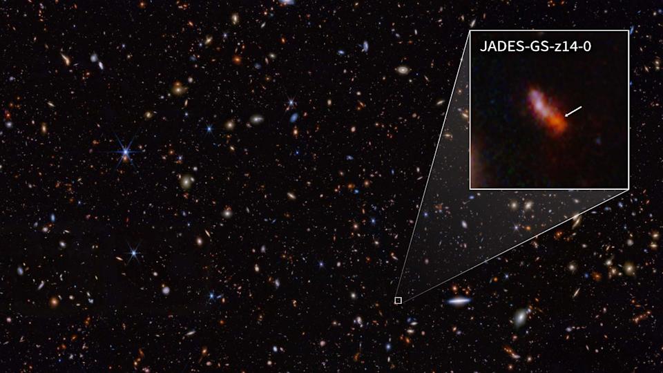 A view of the cosmos with a pullout of a reddish light