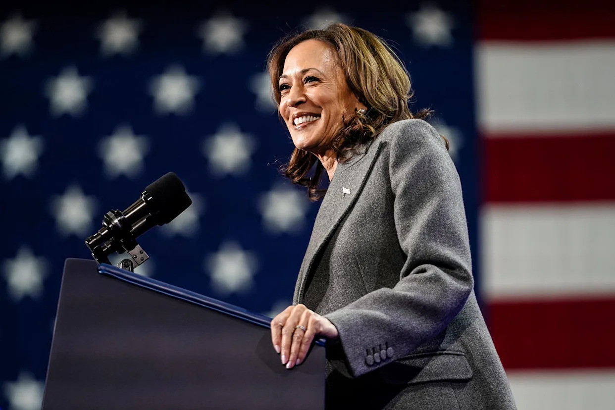 Kamala Harris smiles while standing at a podium (Elijah Nouvelage / Getty Images file)