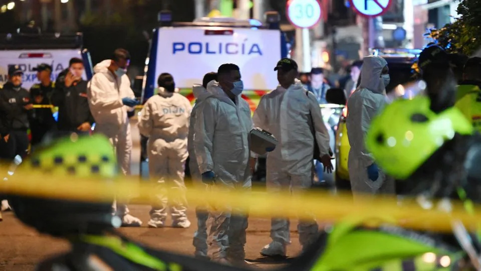 Forensic experts work at the scene where Uribe was shot in Bogota on June 7. - Raul Arboleda/AFP/Getty Images