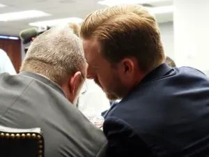 State Superintendent Ryan Walters speaks to Chad Kutmas, counsel for the Oklahoma State Board of Education, during a board meeting Feb. 27 in Oklahoma City. (Photo by Nuria Martinez-Keel/Oklahoma Voice)