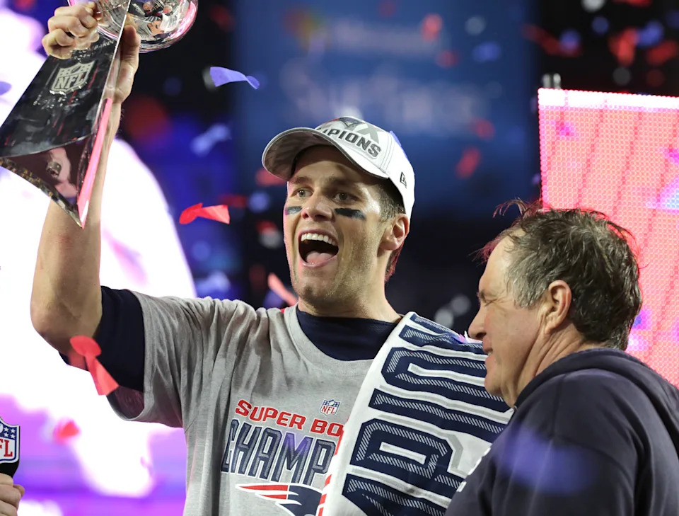 NFL fans saw Tom Brady and Bill Belichick raise the Lombardi Trophy. A lot. (Photo by Barry Chin/The Boston Globe via Getty Images)