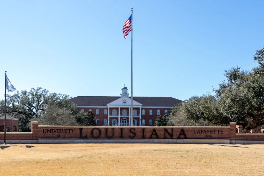 The American flag flies in front of Martin Hall at the University of Louisiana-Lafayette.