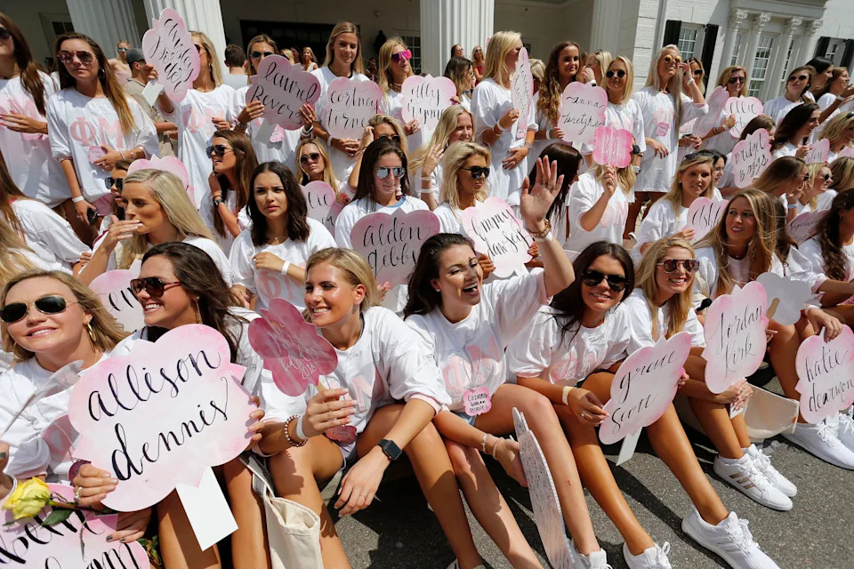 New sorority sisters join their sororities on Bid Day Sunday, August 19, 2018 on Sorority Row outside Bryant-Denny Stadium. New members of Phi Mu wait to have a group photo taken outside their sorority house. [Staff Photo/Gary Cosby Jr.]