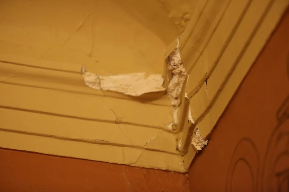 Cracked plaster in the back corner of the state House of Representatives chamber at the South Dakota Capitol in Pierre, as seen in March 2025. (Joshua Haiar/South Dakota Searchlight)