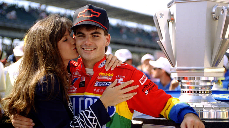 Race car driver Jeff Gordon receives a congratulatory kiss from fiance, Brooke, after winning the inaugural Brickyard 400 NASCAR race at Indianapolis Motor Speedway August 6, 1994 in Indianapolis, IN.