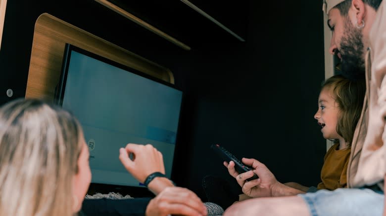 Family watching TV inside an RV