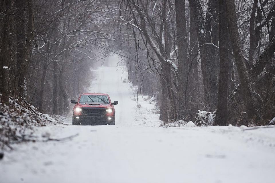 ram rho driving through the woods in the snow