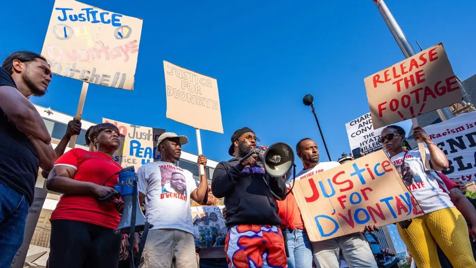 (Center) Karl Harris, the cousin of D’Vontaye Mitchell, makes remarks at a “Justice for Jah and D’Vontaye” rally on July 2024 in Milwaukee. - Jovanny Hernandez/Milwaukee Journal Sentinel/USA Today Network