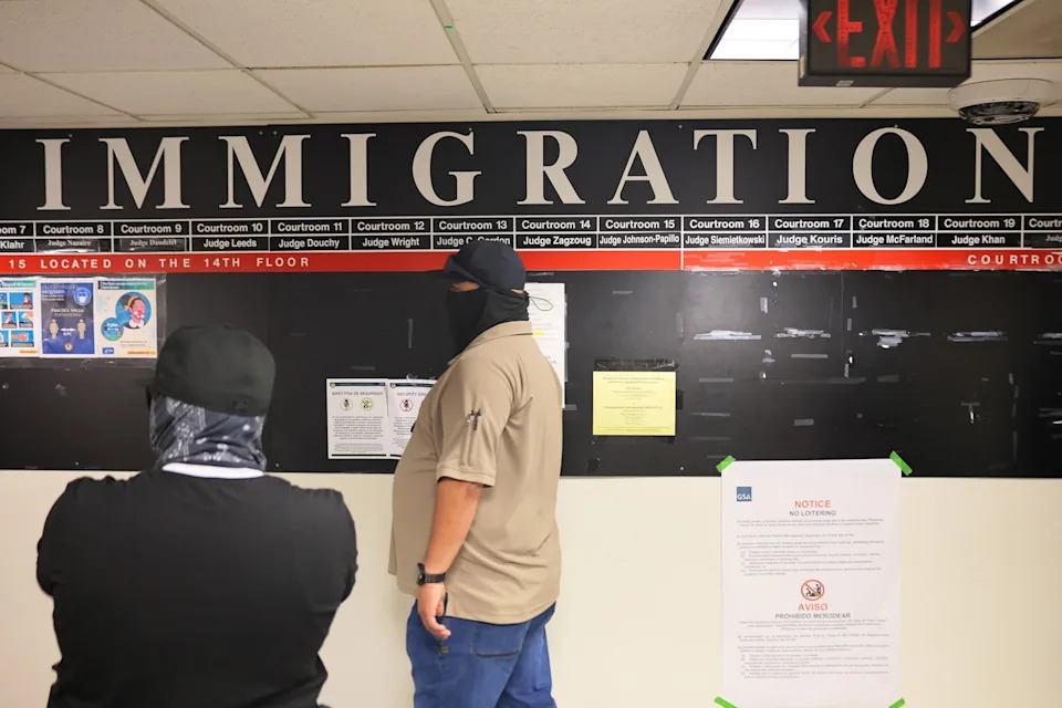 Michael M. Santiago/Getty Images - PHOTO: Federal agents patrol the halls of immigration court at the Jacob K. Javitz Federal Building, on Aug. 25, 2025, in New York.