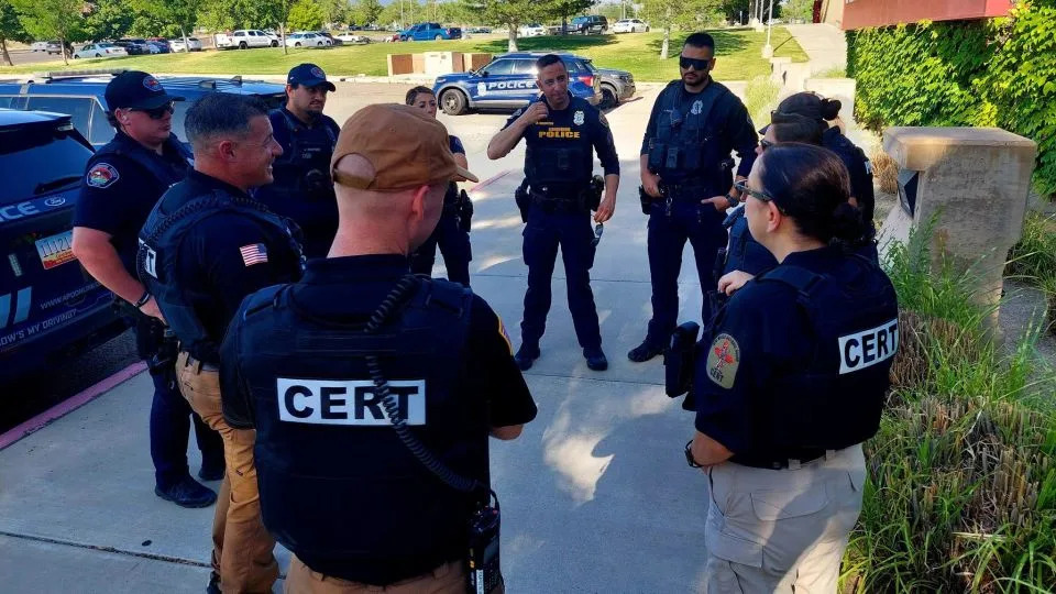 Brig. Gen. Romero, right and Command Sgt. Maj. Poccia, left, talk with members of the Albuquerque Police Department and the National Guard. - New Mexico National Guard