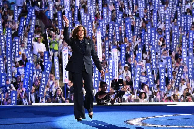 ROBYN BECK/AFP via Getty Kamala Harris takes the stage at the Democratic National Convention on August 22, 2024