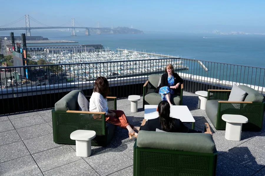 Employees sit on the rooftop terrace at Visa Mission Rock during the Grand Opening on Thursday, June 6, 2024 in San Francisco. (Tony Avelar/AP Content Services for Visa)