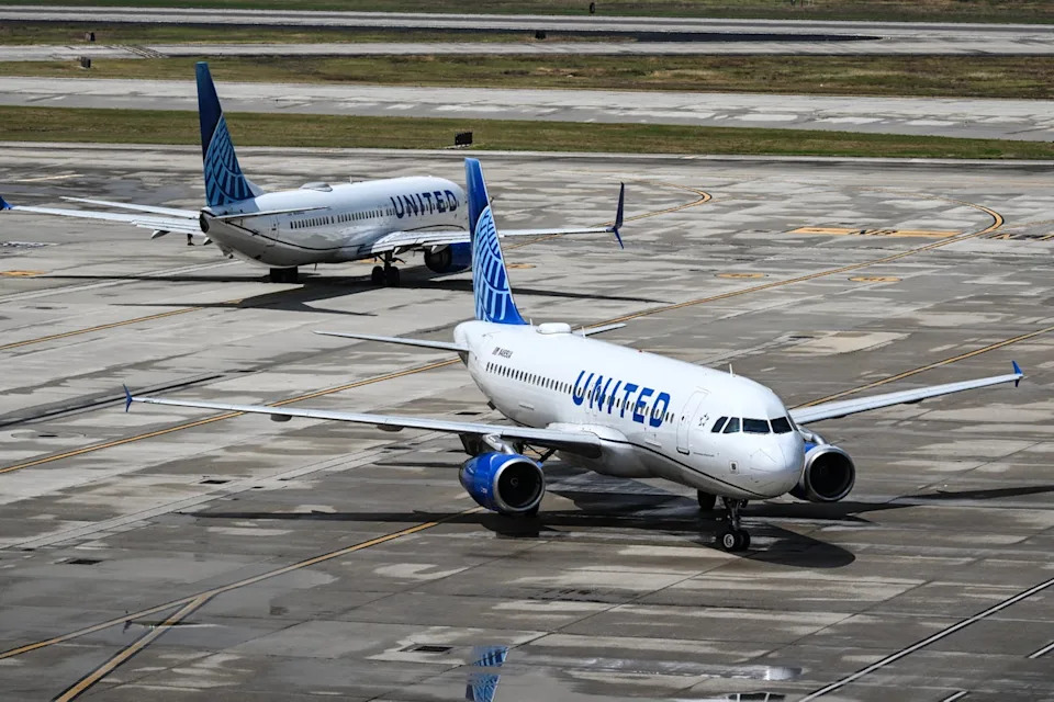 A longtime United Airlines flight attendant is suing his former employer, claiming he was discriminated against for his medical condition of AIDS. (AFP via Getty Images)