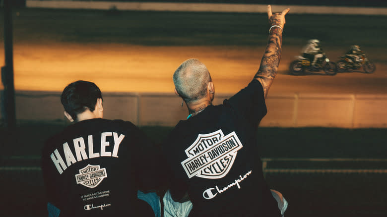 Harley-Davidson fans in branded apparel watch a race