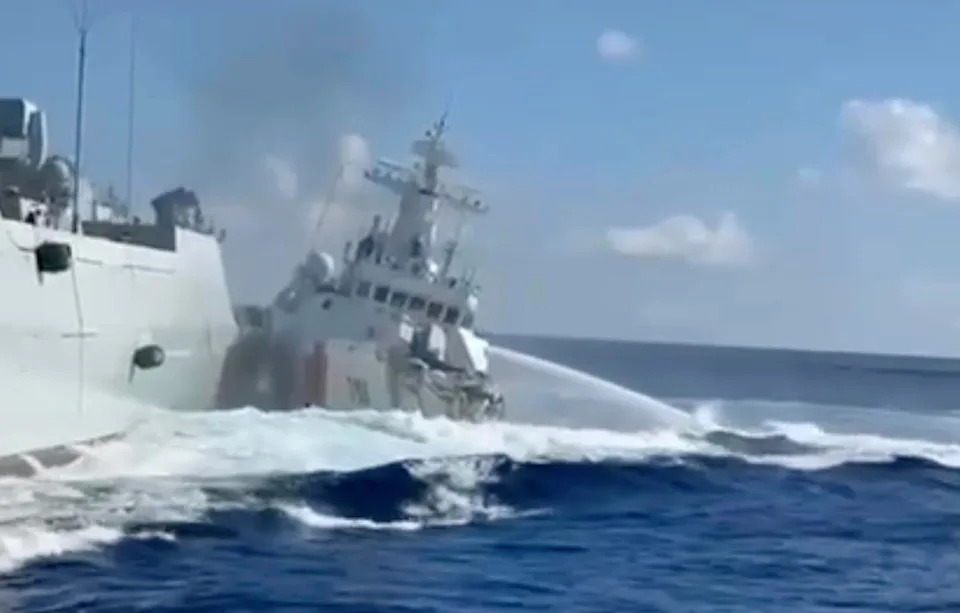 In this photo, taken from video and provided by the Philippine Coast Guard, a damaged Chinese Coast Guard ship, right, is seen beside a Chinese Navy vessel, left, after they accidentally collided while chasing a Philippine fisheries boat near Scarborough Shoal in the disputed South China Sea, Aug. 11, 2025. / Credit: Philippine Coast Guard via AP